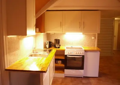a kitchen with a sink and a stove at 5 bedrooms, large apartment with nice view and nature in Herand