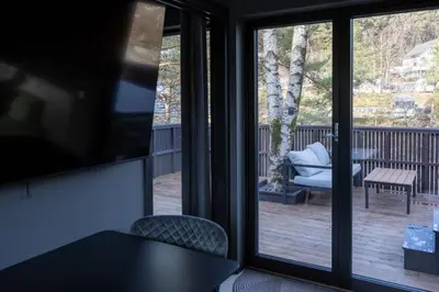 a view of a porch with a table and chairs at Nordica Resort Florø in Florø