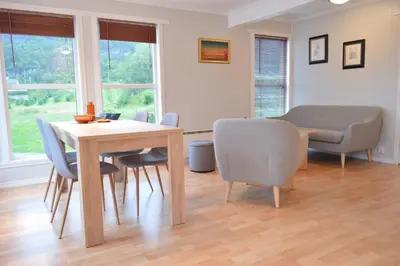 a dining room with a table and chairs at Apartment 2, Herand, Hardanger in Herand