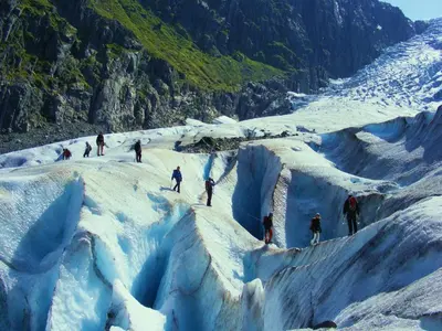 a group of people skiing on a glacier at Trolltunga Camping in Odda
