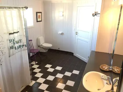 a bathroom with a sink and a toilet at Finnøya with 180* Atlantic veiw in Finnøy
