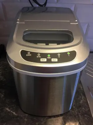 a toaster oven sitting on top of a trash can at Finnøya with 180* Atlantic veiw in Finnøy