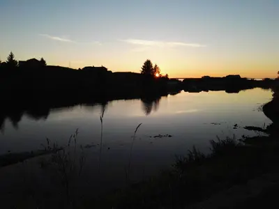 a view of a river at sunset at Kuvågen 23 in Vågenes