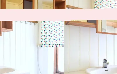 a bathroom with two sinks and a shower curtain at 4 Bedroom Beautiful Home In Steinstø in Steinstø