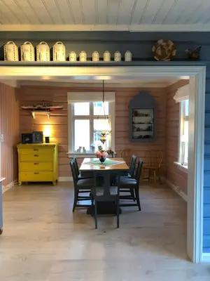 a dining room with a table and chairs at Charming Lakeside House with sauna in Lillehammer