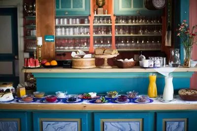 a table with plates of food on top at Nutheim Gjestgiveri in Flatdal