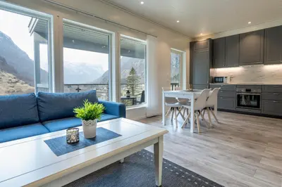 a living room with a couch and a table at Skaimsberg Holiday Apartments in Aurland