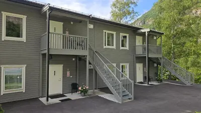 a house with a staircase on the side of it at Skaimsberg Holiday Apartments in Aurland