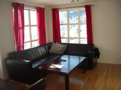 a living room with a couch and a coffee table at Røldal Overnatting in Røldal