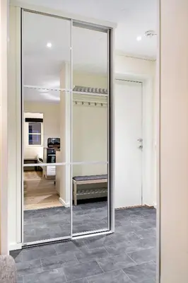 a sliding glass door in a room with a kitchen at Hafjell Alpinlandsby Pluss in Hafjell