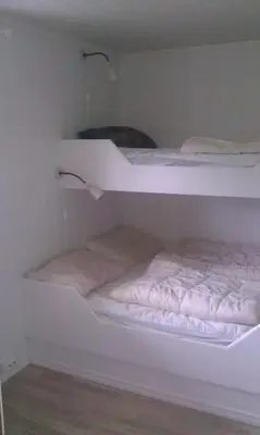 two white bunk beds in a room at Seljestad Cottages in Skare
