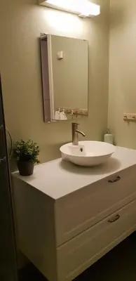 a bathroom with a sink and a mirror at Oppdal Alpintun, Stølen øvre - ski in ski out in Oppdal