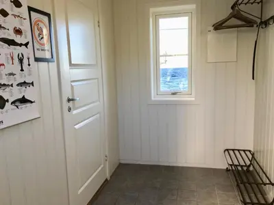 a room with a door and a window at Hindrum Fjordsenter in Vannvikan