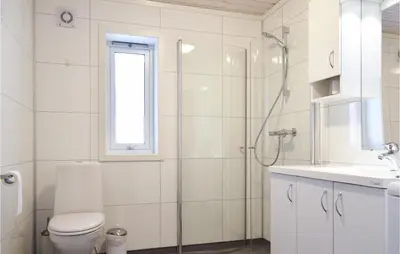 a bathroom with a shower and a toilet and a sink at 3 Bedroom Beautiful Home In Sjusjøen in Sjusjøen