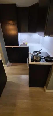 a kitchen with a stove with pots and pans on it at Apartment Bergen Central in Bergen