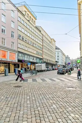 a couple of children playing on a city street at Apartment Bergen Central in Bergen