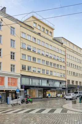 a large building with motorcycles parked in front of it at Apartment Bergen Central in Bergen