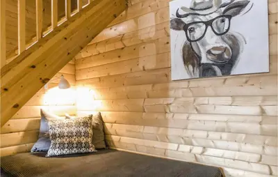 a room with a wall with a painting of a deer at Gorgeous Home In Norheimsund With Wifi in Norheimsund