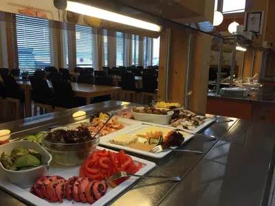 a buffet line with many different types of food at Unicare Røros in Røros