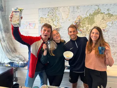 a group of people posing for a picture in a room at Bergen Hostel Montana in Bergen