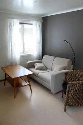 a living room with a couch and a table at Jostedal Hotel in Jostedal