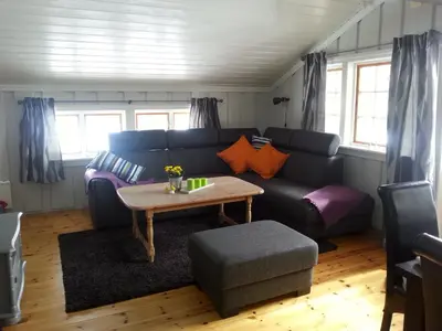 a living room with a couch and a table at Haglebu Feriesenter in Eggedal