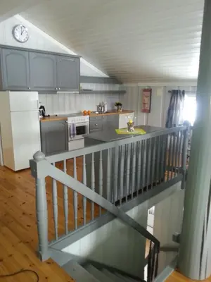 a kitchen with a counter top and a refrigerator at Haglebu Feriesenter in Eggedal