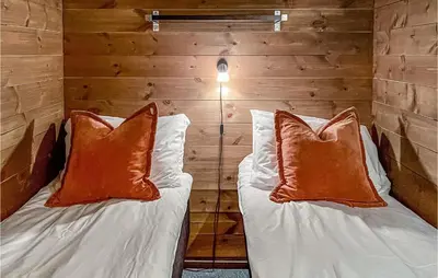 a room with a bed with two pillows at 5 Bedroom Cozy Home In Hemsedal in Hemsedal
