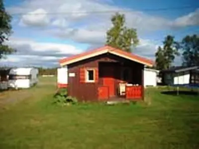 a small house in the middle of a field at Kvanhøgd Turistsenter in Gol