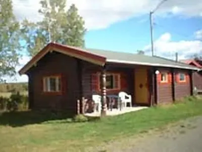 a small house on the side of a field at Kvanhøgd Turistsenter in Gol