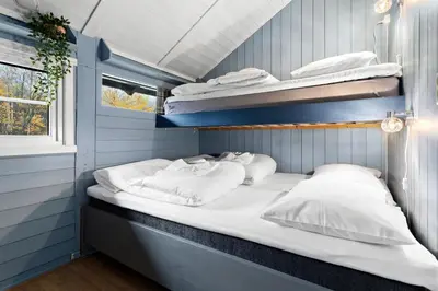 a room with two bunk beds and a window at First Camp Gol Hallingdal in Gol