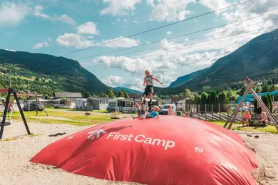 a man standing on top of a first camp tent at First Camp Gol Hallingdal in Gol