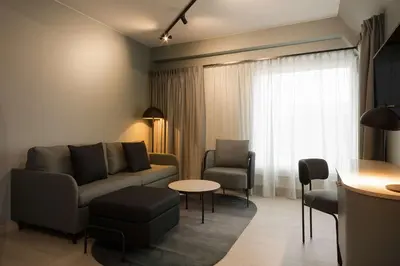 a living room with a couch and chairs and a table at Scandic Victoria Lillehammer in Lillehammer