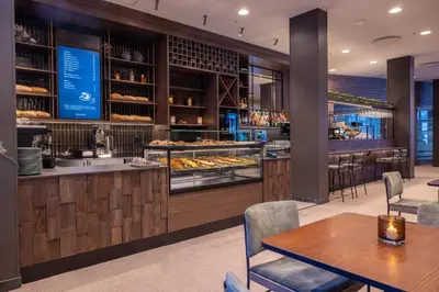 a restaurant with tables and a counter with food at Myrkdalen Resort Hotel in Myrkdalen
