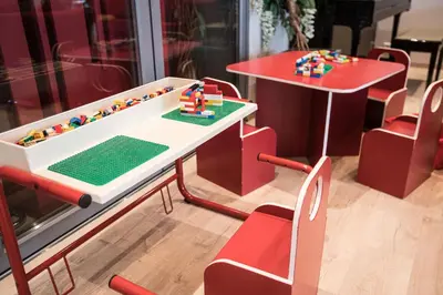 a lego table and a table with legos on it at Almaas Hotell Stord AS in Stord