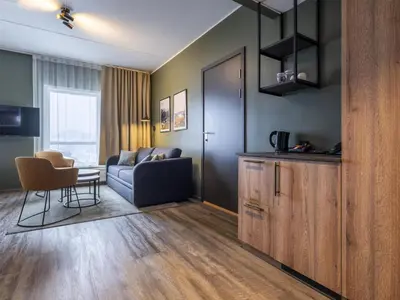a living room with a couch and a table at Radisson Blu Resort, Trysil in Trysil