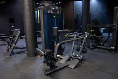 a gym with several tread machines in a room at Honne Hotell in Biri