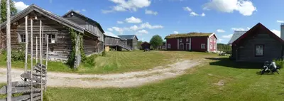 a group of old barns and houses on a field at Vestre Sorken Feriegard in Drevsjø