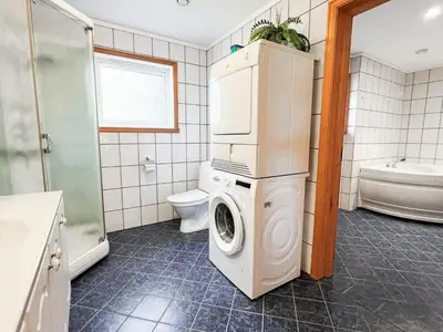 a bathroom with a washer and dryer in it at 6 person holiday home in Leikanger in Leikanger