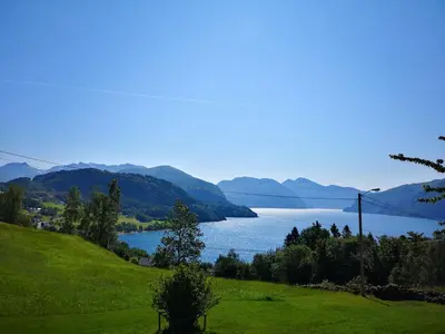 a view of a lake with mountains in the background at Fjords view in Sjøholt