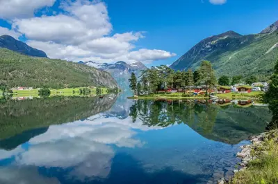 a view of a lake in a valley with mountains at Mindresunde Camping in Mindresunde