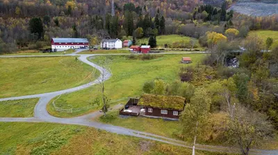 an aerial view of a farm with a house and a road at Sunndalsfjord Cottages Fredsvik Meisalstranda 455,506 og 508 in Sunndalsøra