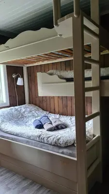 a bunk bed in a room with a bunk bedutenewayewayangering at Sunndalsfjord Cottages Fredsvik Meisalstranda 455,506 og 508 in Sunndalsøra