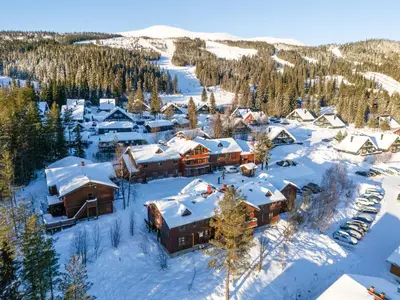 an aerial view of a resort in the snow at Sjumilskogen in Trysil