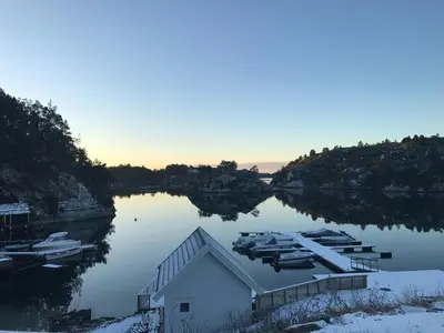 a view of a body of water with boats in it at Havbris in Bremnes