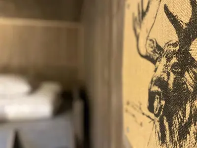 a painting of a deer on a wall at Trysil Hyttegrend in Trysil