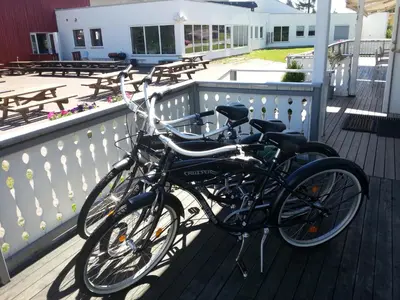 two bikes parked next to each other on a deck at Badeland Gjestegård in Raufoss