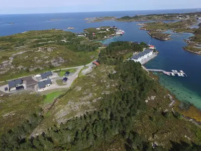 an aerial view of a small island in the water at Atlanterhavsveien Rorbuer in Averoy