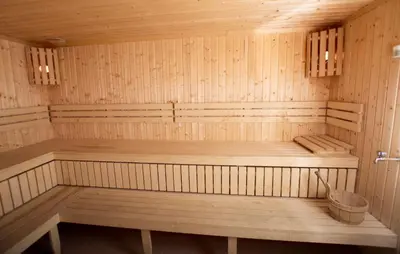 a wooden sauna with a wooden bench in it at Rondaplassen in Kvam