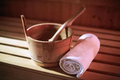 a bucket and a roll of toilet paper on a table at Scandic Kokstad in Bergen